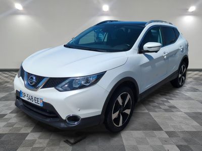 a white nissan qx suv parked in a garage