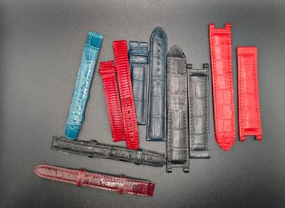 a lot of different types of watch bands on a table