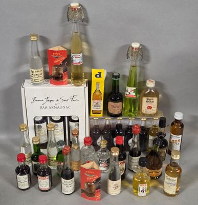 many different bottles of alcohol on the table