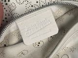 the inside of a white purse with a zipper on it