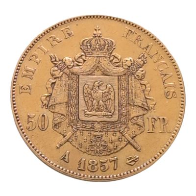 gros plan d'une pièce d'or portant des armoiries