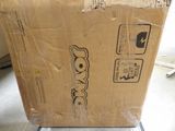 a cardboard box sitting on the floor in the room