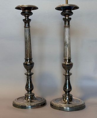 129. Paire de pique-cierges en bronze argenté de style XVIII…