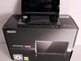 a nintendo wii game system sitting on top of a box