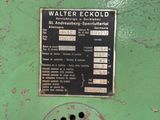 a picture of a machine that is green and has a sign on it