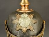 an old helmet with a gold star on the top of it
