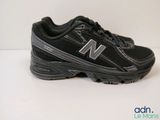 a close up of a pair of new balance shoes on a white surface