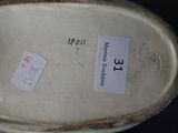 a picture of a close up of a shoe with a label on it