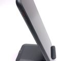 a close up of a cell phone on a stand
