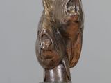 a bronze sculpture of a pig on a marble base