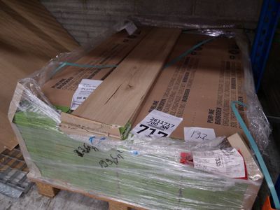 many boxes of wood on a pallet in a warehouse