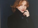 portrait of a woman in a black coat with her hand on her chin