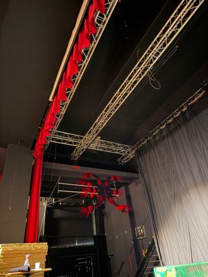 a stage with a red curtain and a stage with a red curtain