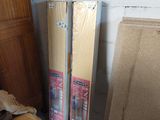 two cardboard boxes sitting next to each other on the floor
