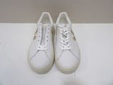 white sneakers with white laces on top of a white surface