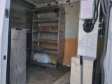 a white van with shelves in the back of it