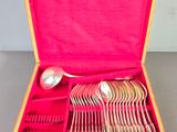 a wooden box with a set of silverware in it