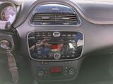 a dashboard of a car with a radio and a steering wheel