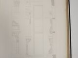 an open book with a drawing of a building on it