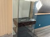 a glass display case with a mirror on it