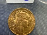 a close up of a gold coin with a label on it