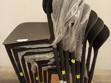 a lot of chairs that are sitting on a cardboard box