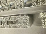 a lot of glass pieces on the shelf