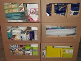 a cardboard cabinet with a lot of supplies on it
