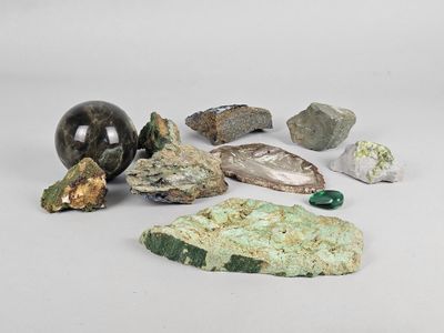 a lot of different rocks and stones on a white surface