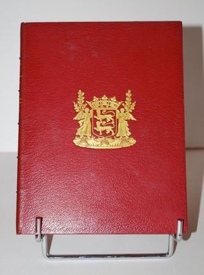 a red book with a gold crest on it