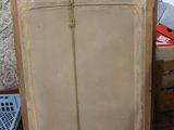 a wooden cabinet with a clock on top of it