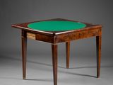 a small table with a green top and two legs