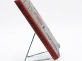 an image of a book on a stand on a white background