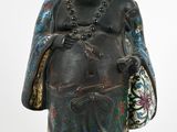 statue d'un Bouddha souriant tenant un sac d'argent