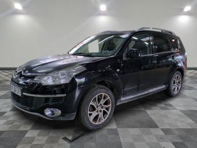 a picture of a black suv parked in a showroom