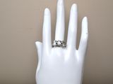 a white mannequin hand with a ring on it