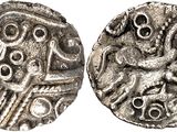 a silver coin with an image of a man on it