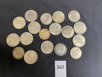 a lot of coins sitting on a table with a price tag