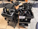 a pile of electronics on a cart in a store