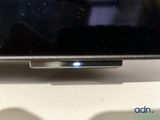 a flat screen tv sitting on top of a table