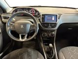the interior of a small car with a steering wheel and dashboard