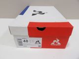 a red and white box on a white table