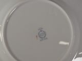 a white plate with a blue and white design on it