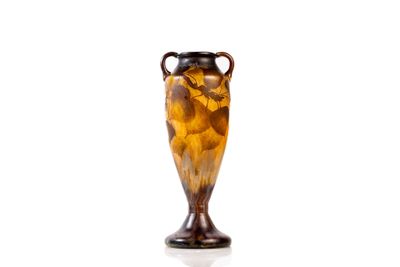 a vase that is sitting on a white surface