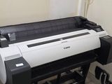 a large printer that is sitting on the floor