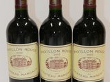 three bottles of wine sitting on top of a table next to each other