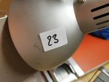 a desk lamp that has a sticker on it