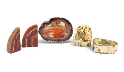 several different types of stones are arranged on a white surface