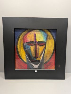 tableau représentant le visage d'un homme avec une croix, dans un cadre noir