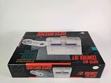 the box of the nintendo classic console is open on a white surface